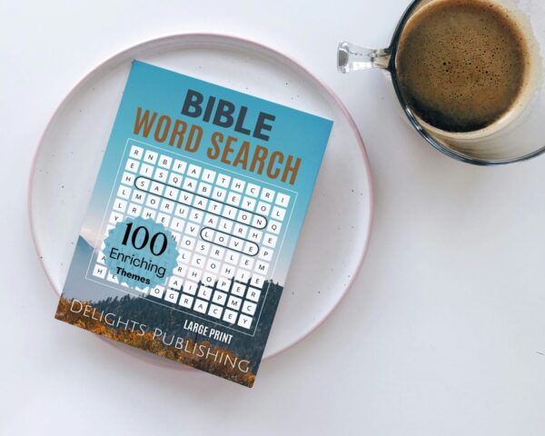 A bible word search book on a plate next to a coffee cup